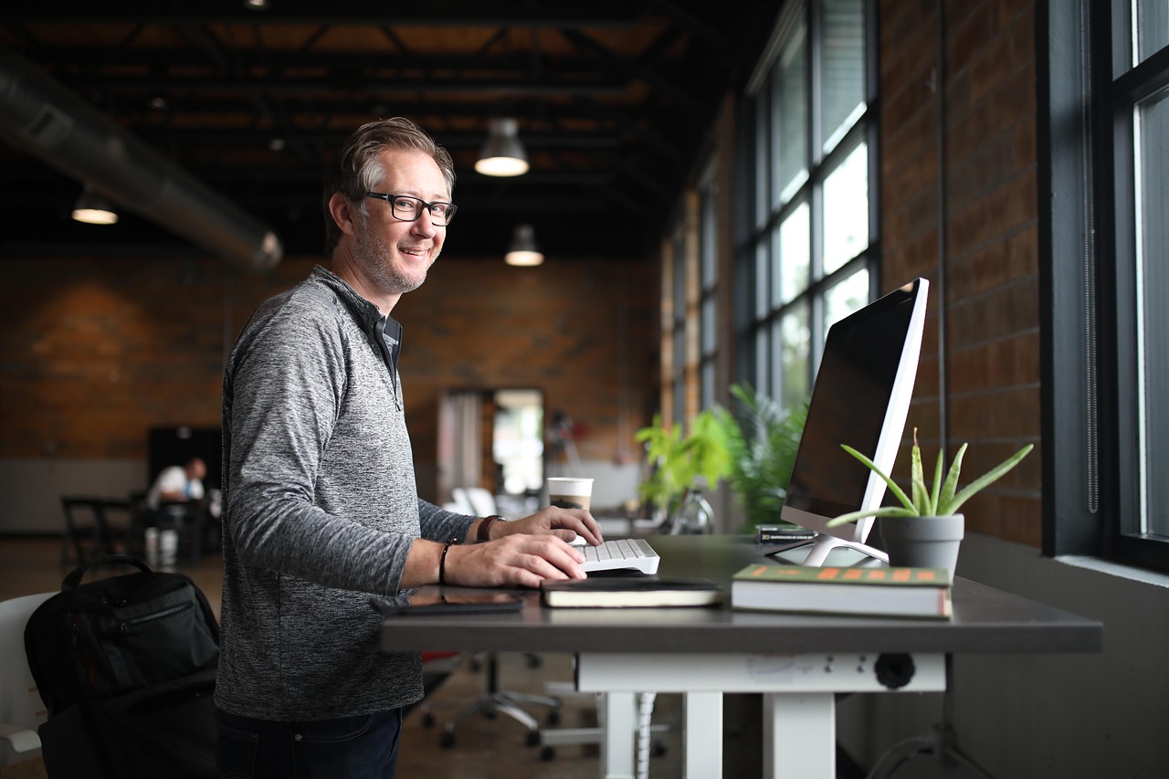 Office desk, man, business — Construction project management tools for seamless coordination